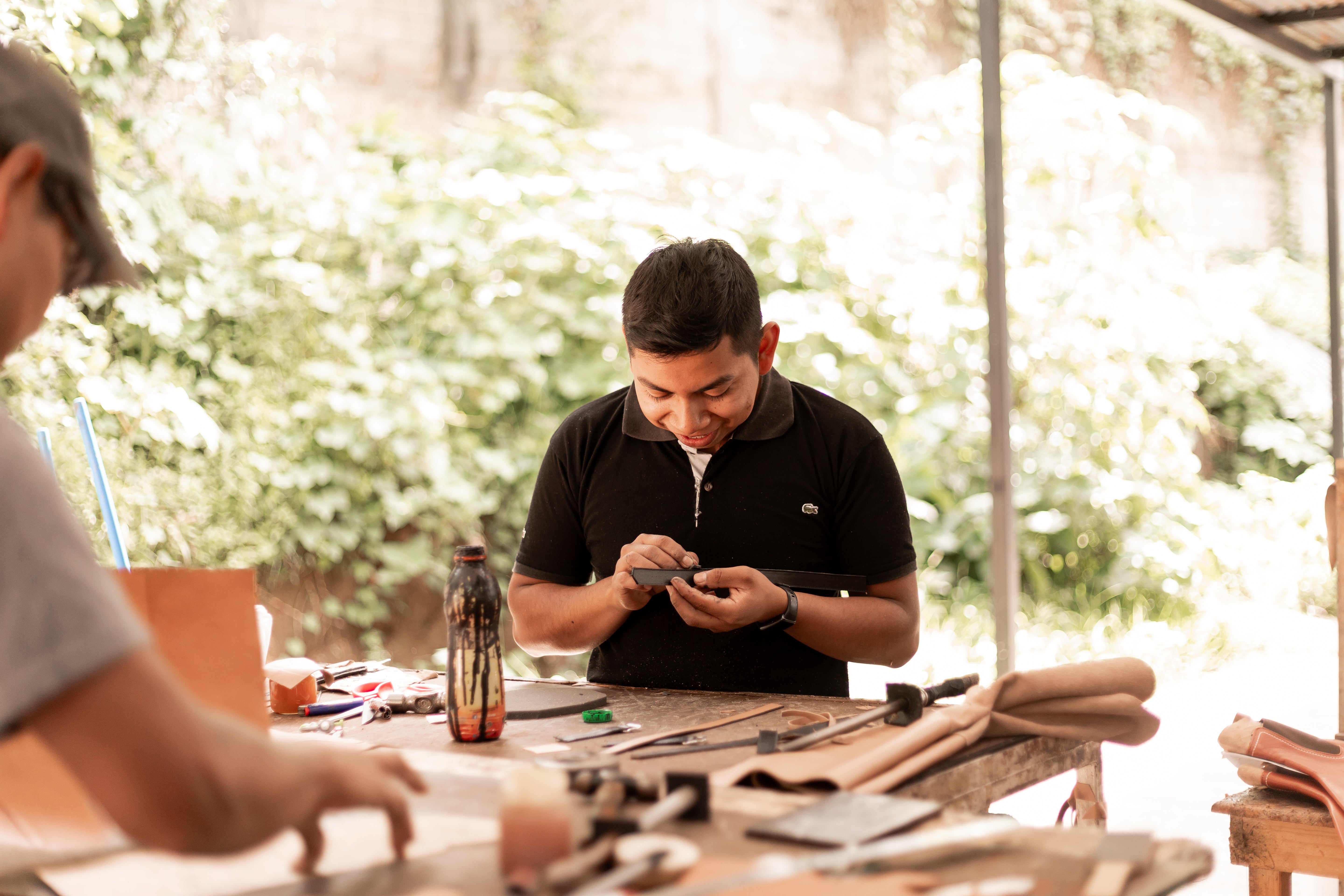 Guatemala Leather Artisan crafting a leather purse