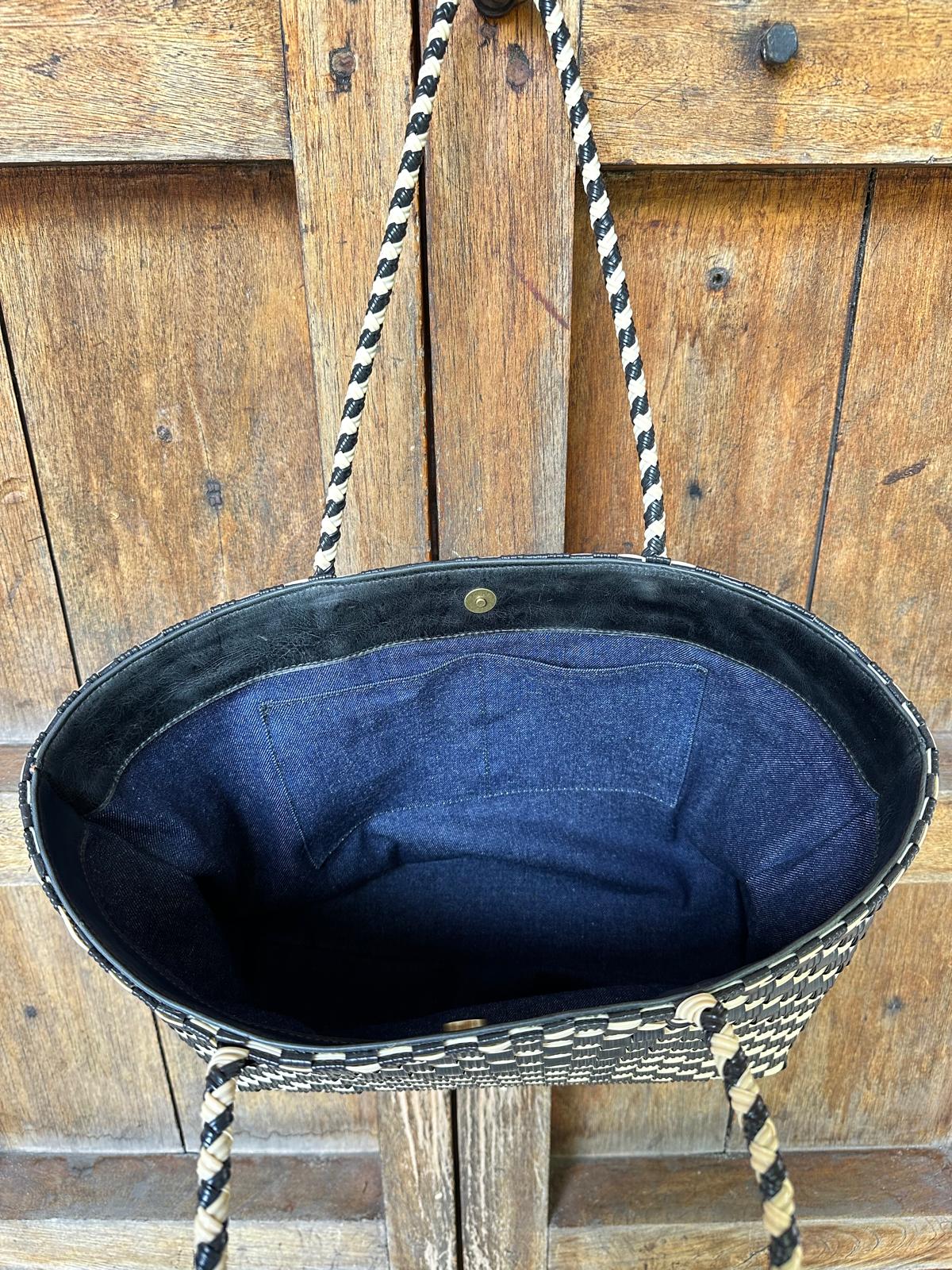 Interior upcycled denim lining of the Isla Tote beach bag by Lauren Reed Co. showing inside pockets