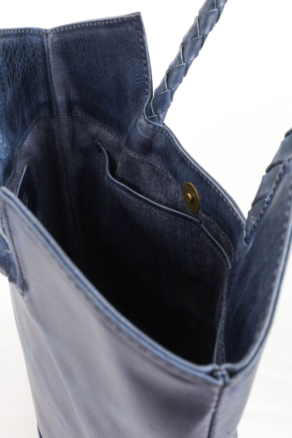 Close-up of a blue denim bag with a white background