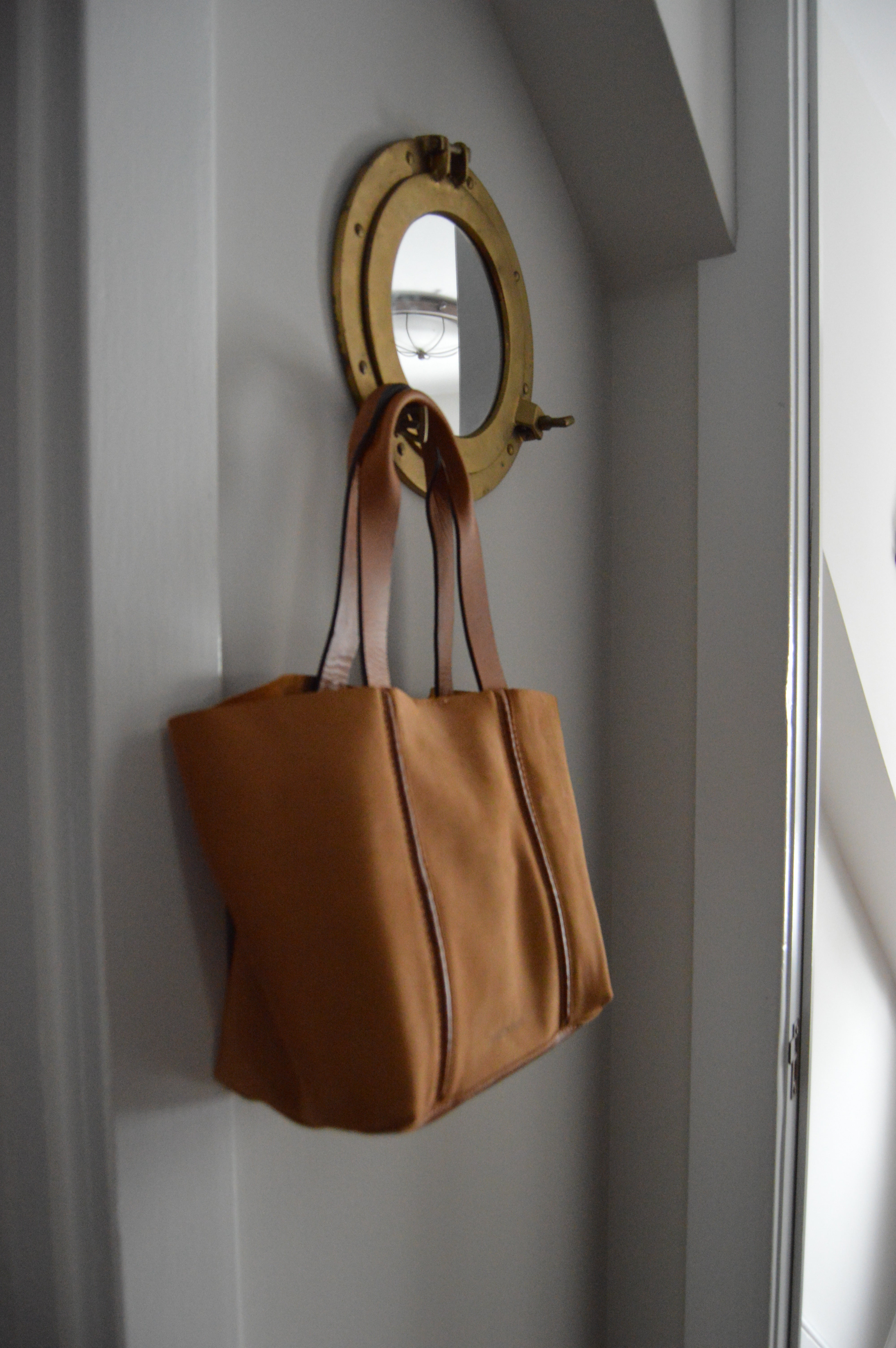 Leather Bag Handing on nautical mirror