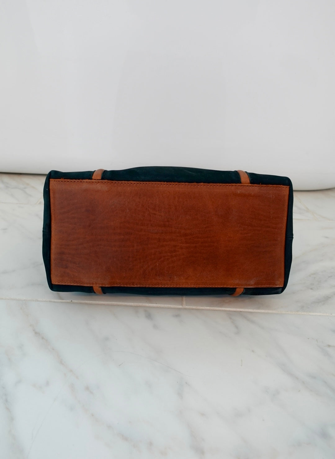 Leather Purse bottom angle on a marble surface