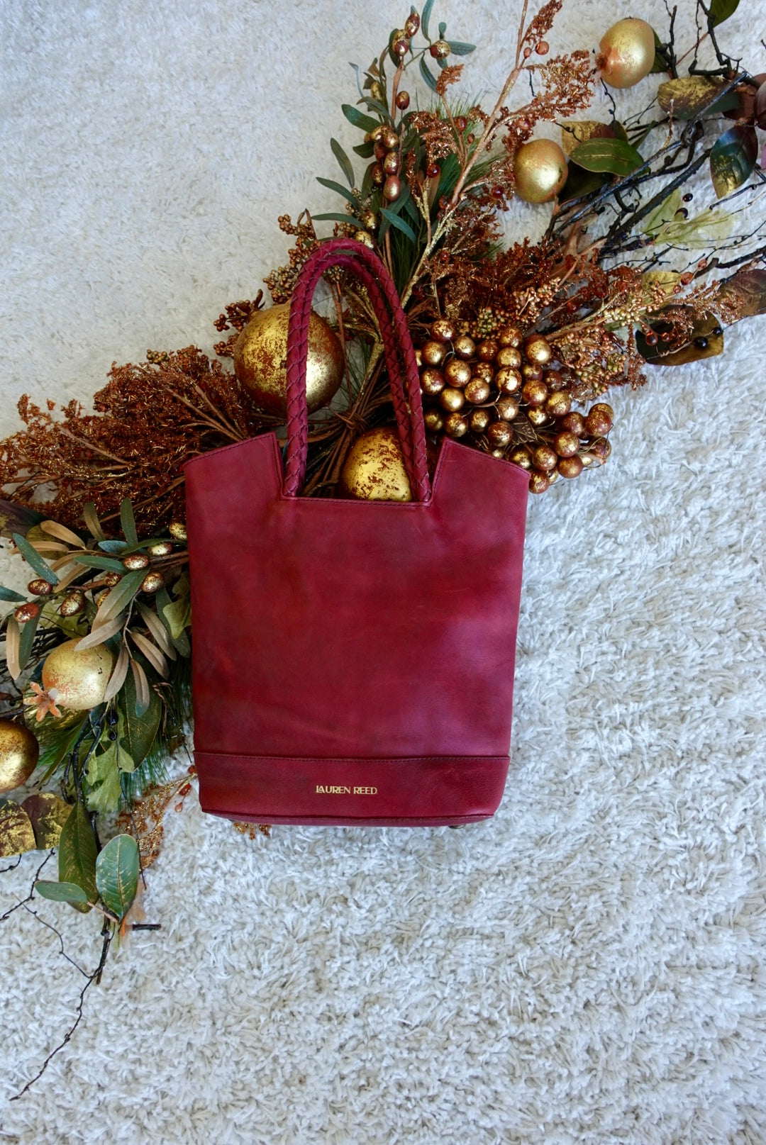 Red leather tote bag with holiday decor