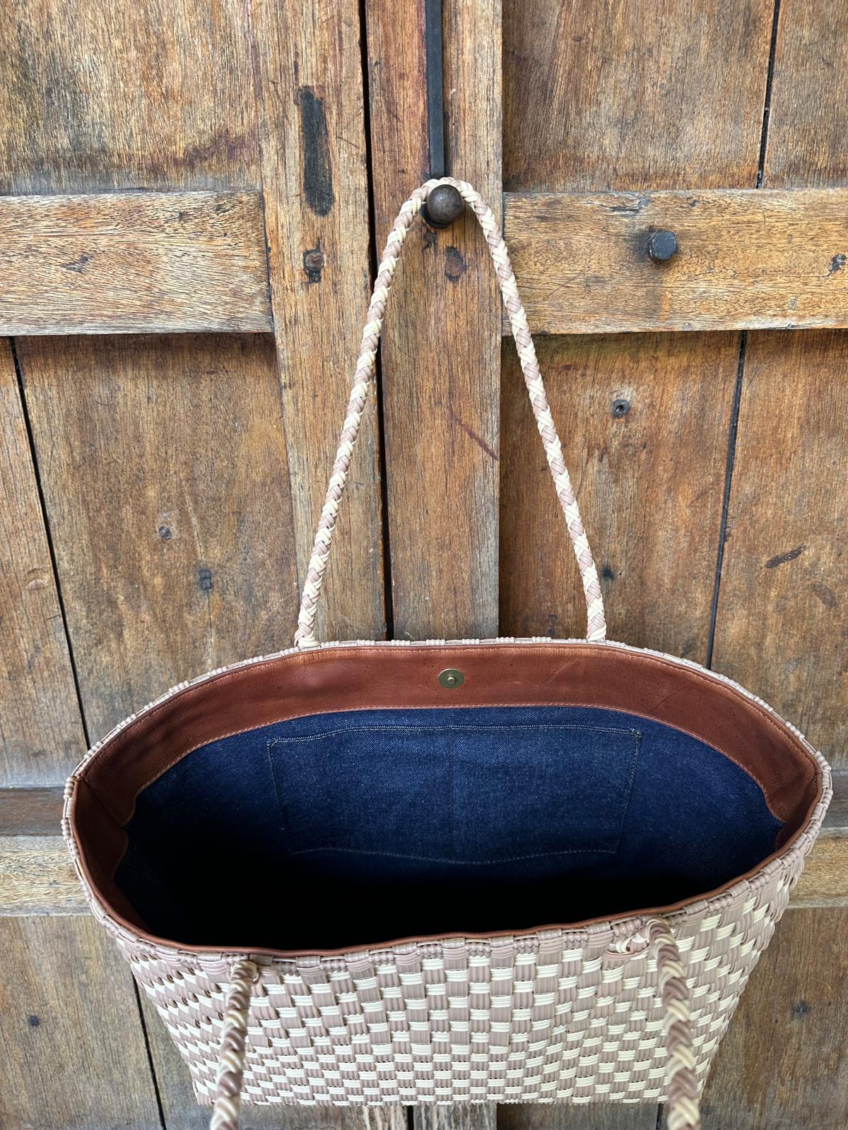 Interior upcycled denim lining of the Tan & Cream Isla Tote beach bag by Lauren Reed Co. with pockets