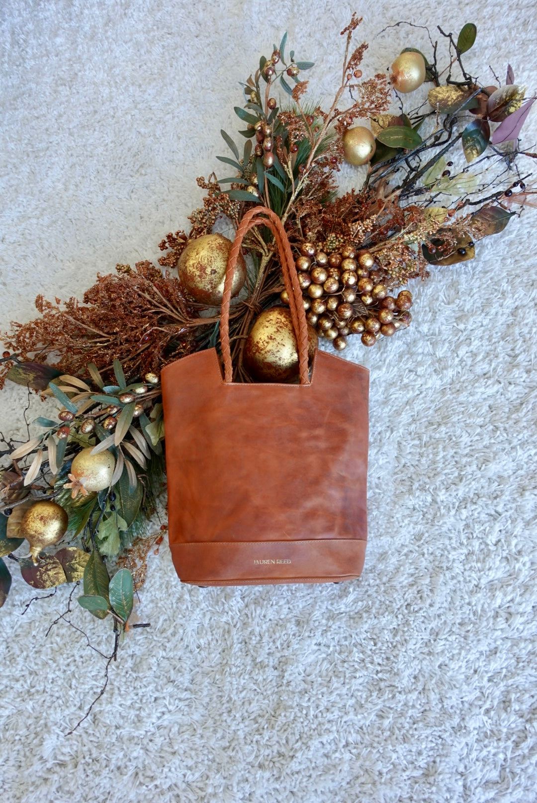 Rustic tan leather tote bag purse with winter decor 