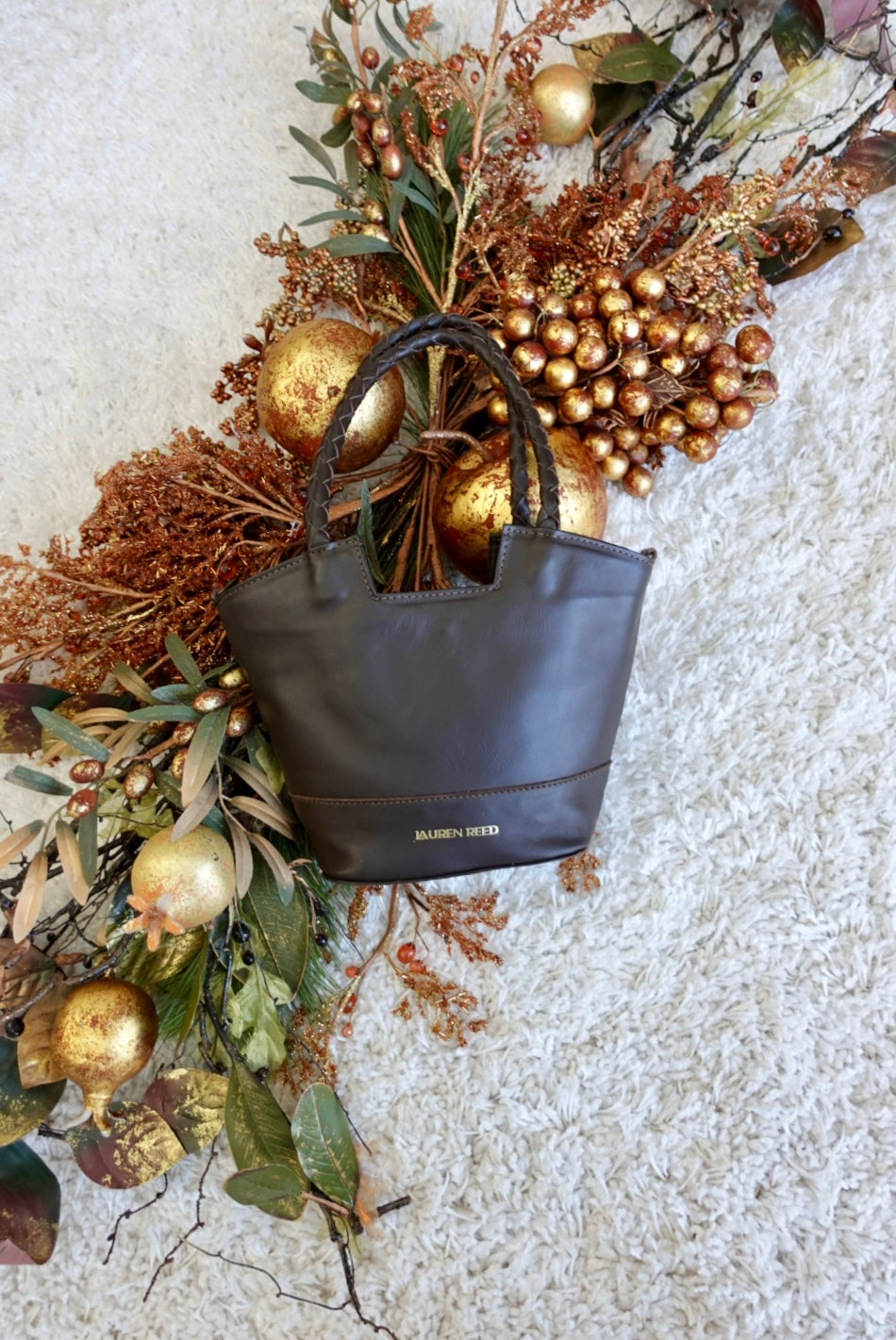 Espresso brown leather bag with winter decor 
